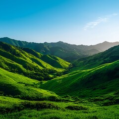 Naklejka premium Lush Green Mountains Under Clear Blue Sky during Daytime Scenery