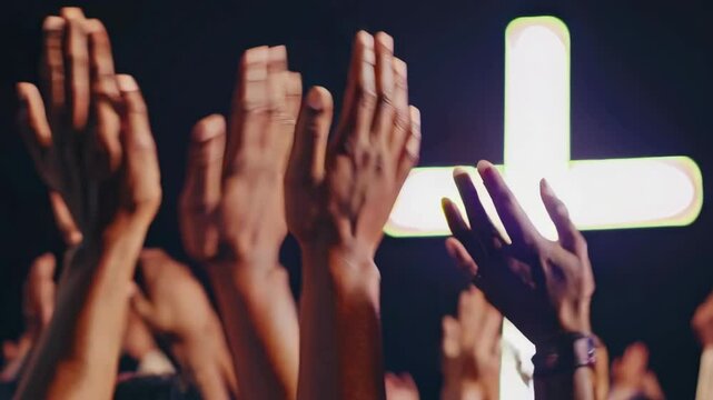 hands of a crowd of people at a Christian meeting during the glorification praise of God against the background of the cross
