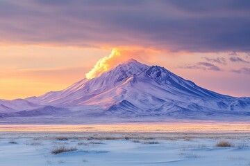 Fototapeta premium Majestic volcano erupting at sunset in a snowy landscape