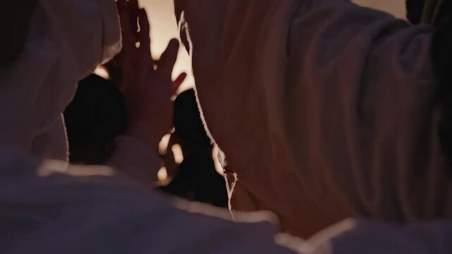 hands of a crowd of people at a Christian meeting during the glorification praise of God against the background of the cross