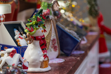 Holiday decorations displayed on a festive table with various figurines and ornaments enhancing the seasonal atmosphere