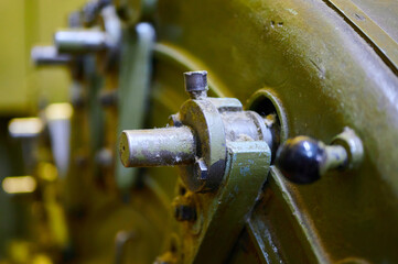 Intricate details of vintage textile machinery showcasing craftsmanship and industrial design in a historic workshop