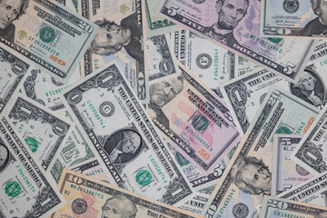different US dollar banknotes background