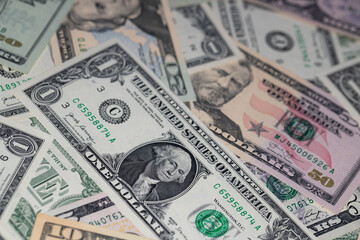 different US dollar banknotes background