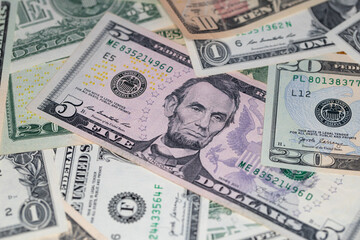 different US dollar banknotes background