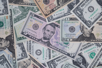 different US dollar banknotes background