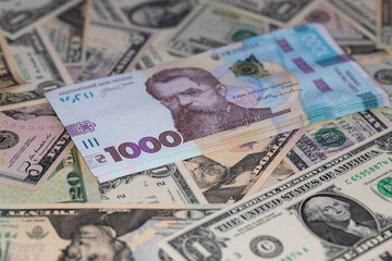 100 dollar and 1000 hryvnia banknotes