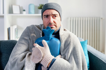 Man suffering cold at home and problem with house heating