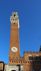 Clock of the ancient medieval tower called TORRE DEL MANGIA in the city of Siena in the Tuscany Region in Italy © ChiccoDodiFC