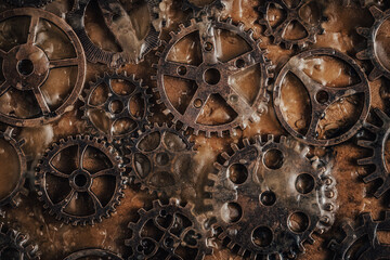 Rusty gears on an industrial background create conceptual grunge composition.