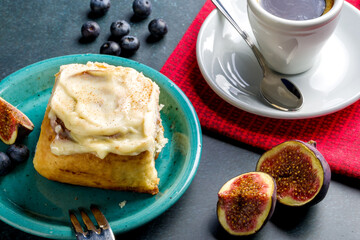 Homemade cinnabons with cinnamon and cream cheese.