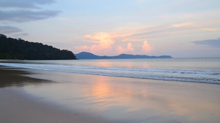 Naklejka premium Tropical Beach with Soft Waves and Pastel Sunset Sky – Relaxing Coastal Landscape