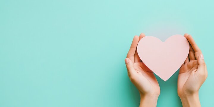Close-up of woman holding heart paper
