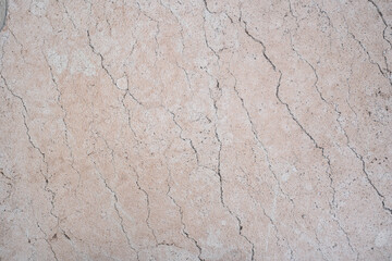 Light beige textured stone with visible cracks