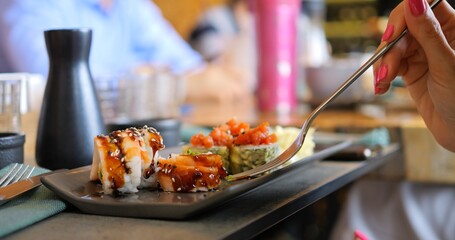 Business lunch in Japanese style. Japanese cuisine takes center stage during productive meeting. Sushi rolls on table add refined touch to professional setting, blending food and business seamlessly.