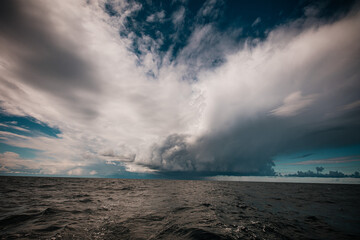 beautiful sky with thickening heavy clouds and a strong thunderstorm before the rain.Bad weather and environment. carbon dioxide emissions, greenhouse effect, global warming, climate change.