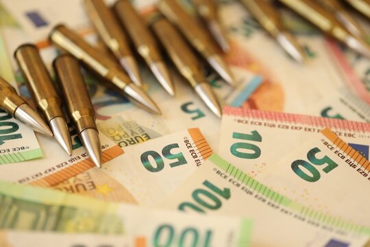 Golden cartridges and big pile of euro money bills