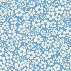 Vintage flowers pattern. Small flowers scattered over a blue background. Seamless pattern for design and fashion prints,Stock vector for printing on surfaces. Realistic flowers.