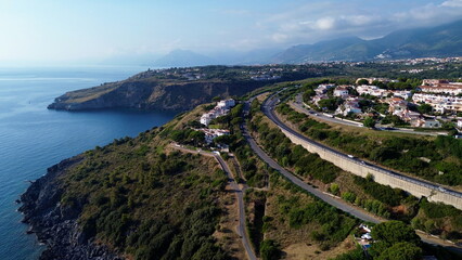 Scenographic aerial view of Calabria Cost with hypnotic blue color sea in summer time