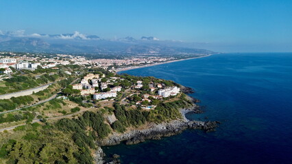 Scenographic aerial view of Calabria Cost with hypnotic blue color sea in summer time