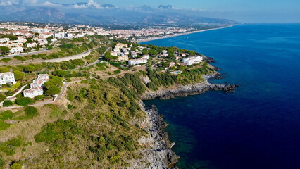 Scenographic aerial view of Calabria Cost with hypnotic blue color sea in summer time