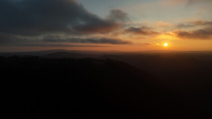 Moody sunset with haze over french landscape countryside   drone view