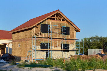 New energy efficient straw house under construction. Using environmentally friendly building...