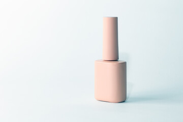 Peach Pink Bottle of gel nail polish. Nail service. Beauty industry. Hand care cosmetics. Manicure and pedicure.