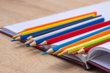 Colored pencils and a notebook