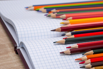 Colored pencils and a notebook