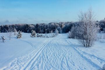 the road through the snow going into the distance. winter landscape