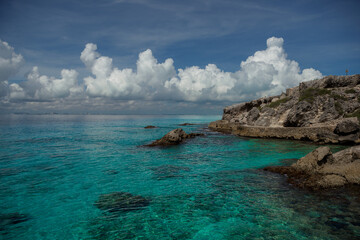 Fototapeta premium Rocky Caribbean Sea coastline with rocks and azure water.