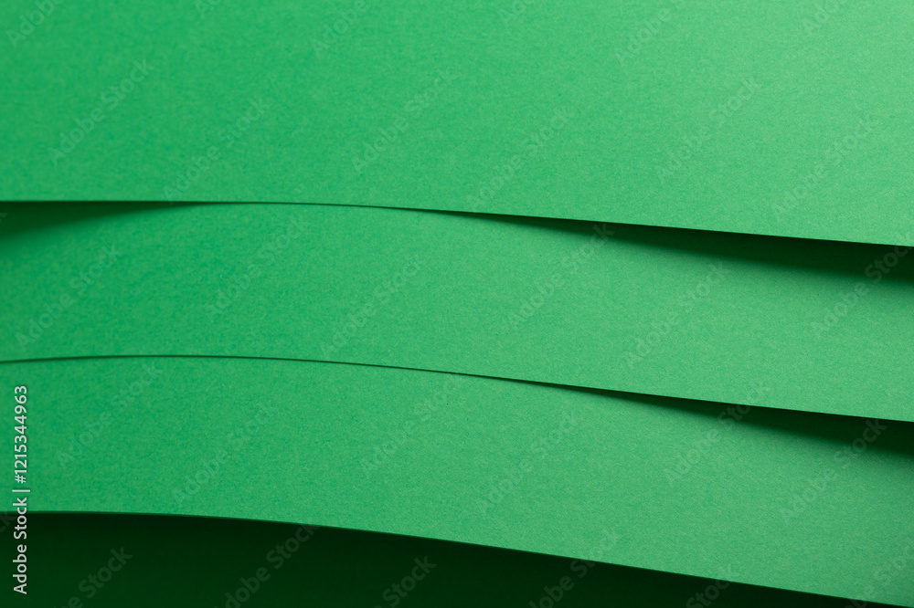 Poster eden green paper background with layered, curved sheets and a smooth matte finish. vibrant, soft ton