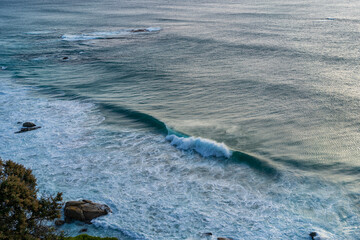 Beautiful ocean waves at a beach in Cape Town South Africa at sunset