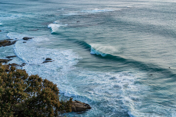 Beautiful ocean waves at a beach in Cape Town South Africa at sunset