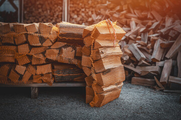 A package of dry firewood for heating the house. A bundle of firewood. Beech wood in a package.