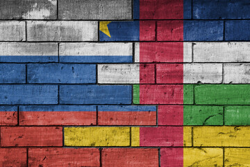 Fototapeta premium colourful painted big flag of russia and flag of central african republic on a massive old brick wall background. concept