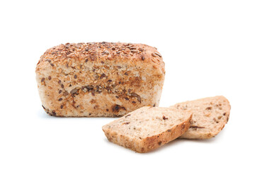 Freshly baked craft bread with cereals loaf whole and slices. Homemade bakery products.