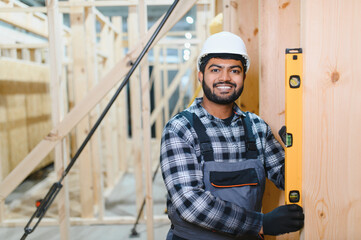 Construction of modular houses. Indian construction worker or engineer at construction site