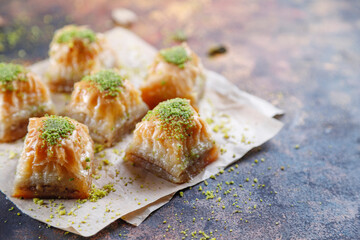 Turkish-style pistachio baklava with a glass of milk.