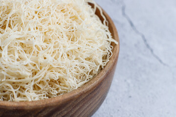 Homemade uncooked kataifi or kadaifi dough.