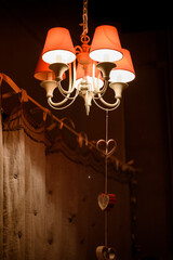 Red chandelier for lamps with briloks in the form of hearts