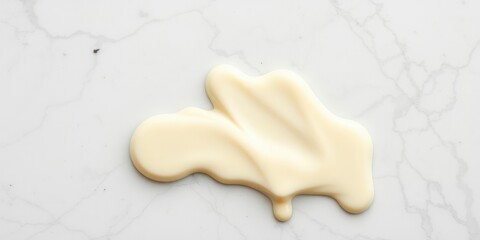 Creamy light milk chocolate drips onto a marble surface, sweet treat, rich aroma