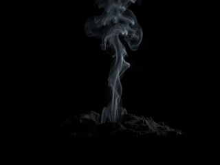 Dark smoke rises from a small crater in the ground on a black background, lava bomb, dark fog rises, explosive force
