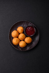 Crispy French fries with mozzarella cheese with raspberry sauce