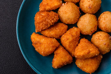 Brie cheese or camembert fries in breading, fast food, takeaway