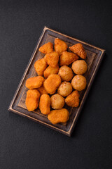 Fast food brie fries, cheese balls and chicken nuggets