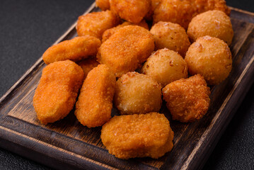Fast food brie fries, cheese balls and chicken nuggets