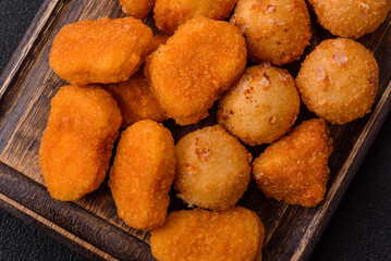 Fast food brie fries, cheese balls and chicken nuggets