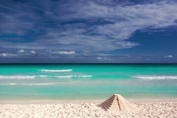 Fototapeta premium Pyramid of sand on the shores of the Caribbean Sea.